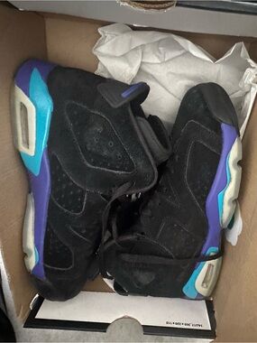Jordan’s Black Suede Basketball Shoes with Purple & Teal Accents